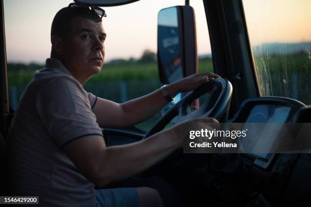 the man driving a truck. - passenger cabin stock pictures, royalty-free photos & images