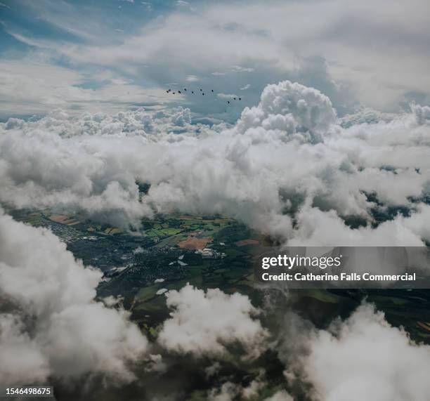 view from above the clouds of an irish landscapes - urban air vehicle stock pictures, royalty-free photos & images