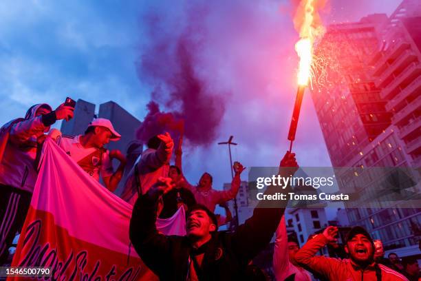 Fan of River Plate holds a flare outside the stadium prior a match between River Plate and Estudiantes as part of Liga Profesional 2023 at Estadio...