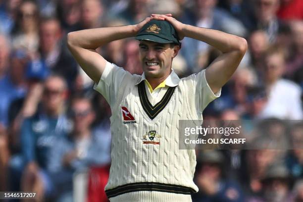 Australia's Pat Cummins reacts in the field on day three of the fourth Ashes cricket Test match between England and Australia at Old Trafford cricket...