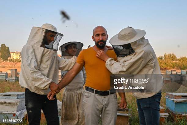 Beekeeper Abdulvahap Semo performs his attempt to set a bee wearing record in the Guinness World Records, in Van, Turkiye on July 12, 2023. Weighing...