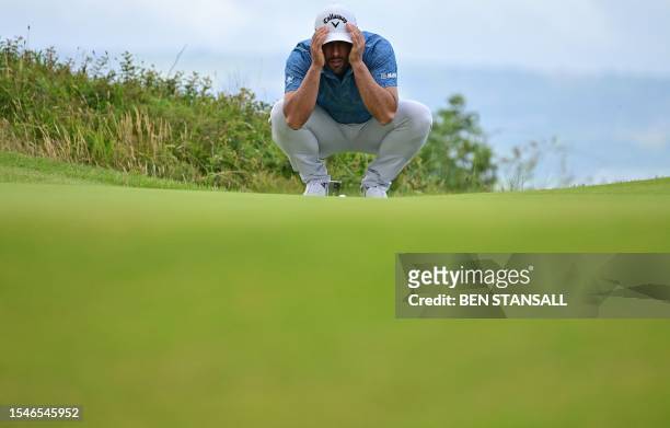 Spain's Adrian Otaegui lines up a putt on the 14th green on day two of the 151st British Open Golf Championship at Royal Liverpool Golf Course in...