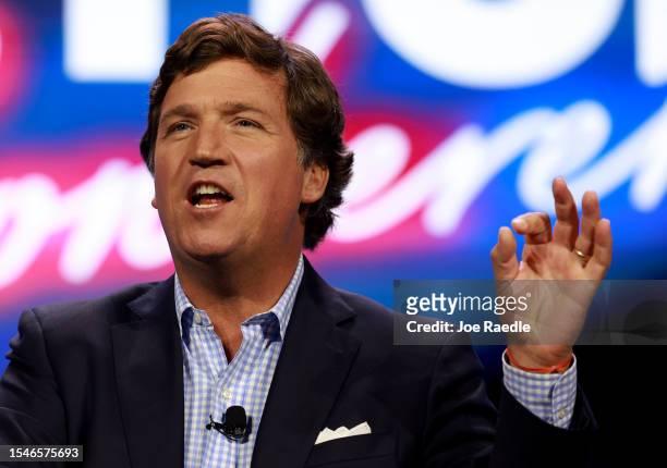 Tucker Carlson speaks at the Turning Point Action conference on July 15, 2023 in West Palm Beach, Florida. Trump is scheduled to speak at the event...