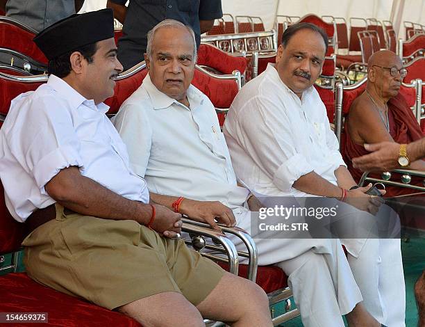 Bharatiya Janata Party president Nitin Gadkari chats with MP Banwarilal Purohit and BJP MP Ajay Sanchite during the Rashtriya Swayamsevak Sangh...