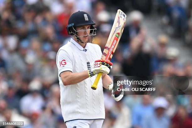 England's Harry Brook celebrates after reaching his half century on day three of the fourth Ashes cricket Test match between England and Australia at...