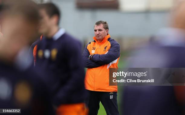 Liverpool manager Brendan Rodgers watches his players during a training session ahead of their UEFA Europa League group match against FC Anzhi...