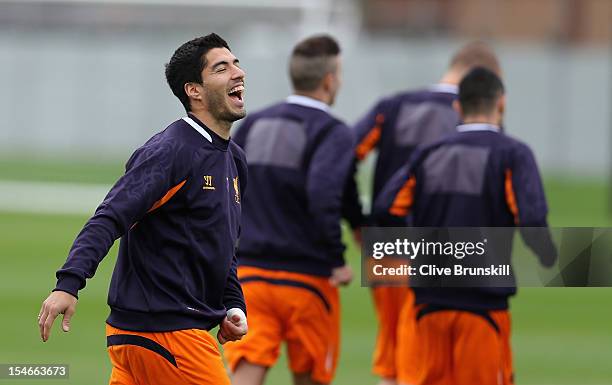 Luis Suarez of Liverpool in good spirits during a training session ahead of their UEFA Europa League group match against FC Anzhi Makhachkala at...