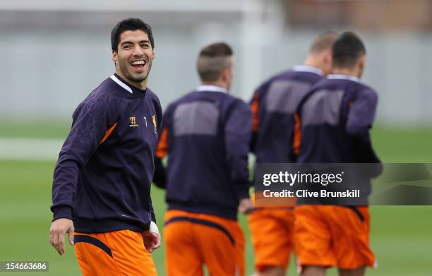 Luis Suarez of Liverpool in good spirits during a training session ahead of their UEFA Europa League group match against FC Anzhi Makhachkala at...