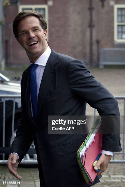 Mark Rutte, leader of the Dutch Liberal Party , arrives at the parliament building in The Hague, on October 24 where the negotiations to form a new...