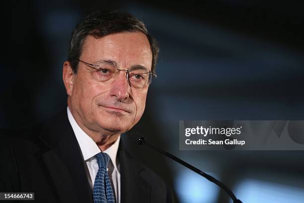 Mario Draghi, President of the European Central Bank , speaks to the media at the Bundestag after he spoke to German parliamentarians on October 24,...