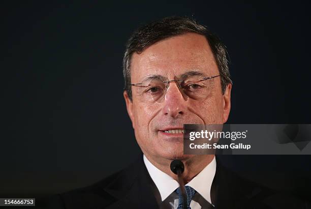 Mario Draghi, President of the European Central Bank , speaks to the media at the Bundestag after he spoke to German parliamentarians on October 24,...
