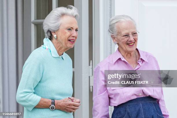 Denmark's Queen Margrethe II and her sister Denmark's Princess Benedikte watch the changing of the guard at Graasten Castle, Grasten, Denmark on July...