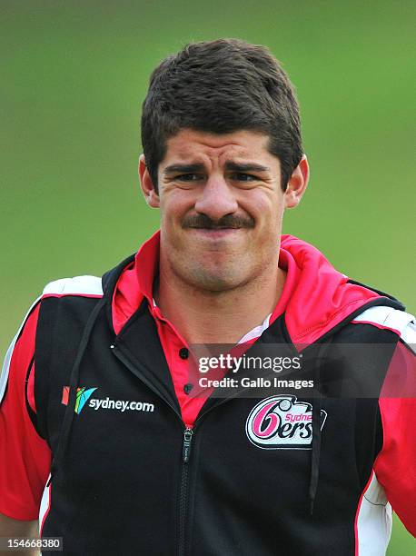 Moises Henriques stretches during a Sydney Sixers training session at Bidvest Wanderers Stadium on October 24, 2012 in Johannesburg, South Africa.