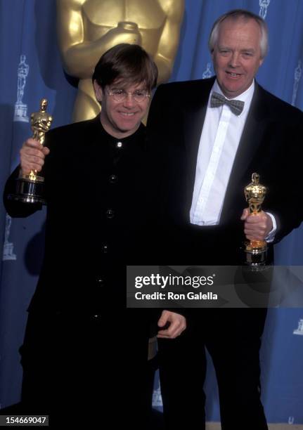 Musician Elton John and lyricist Tim Rice attend the 67th Annual Academy Awards on March 27, 1995 at Shrine Auditorium in Los Angeles, California.