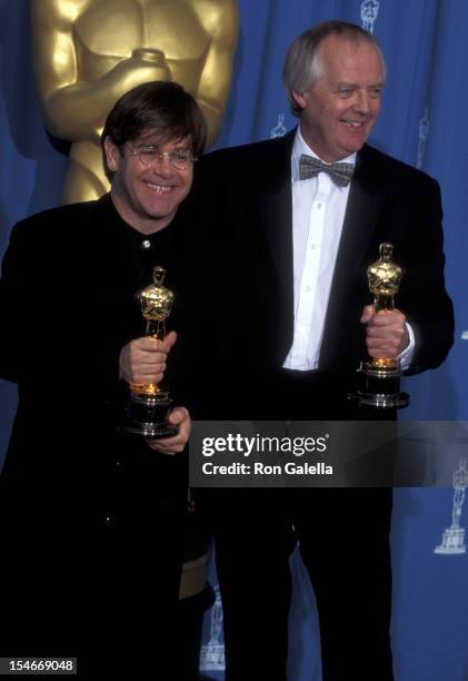 Musician Elton John and lyricist Tim Rice attend the 67th Annual Academy Awards on March 27, 1995 at Shrine Auditorium in Los Angeles, California.