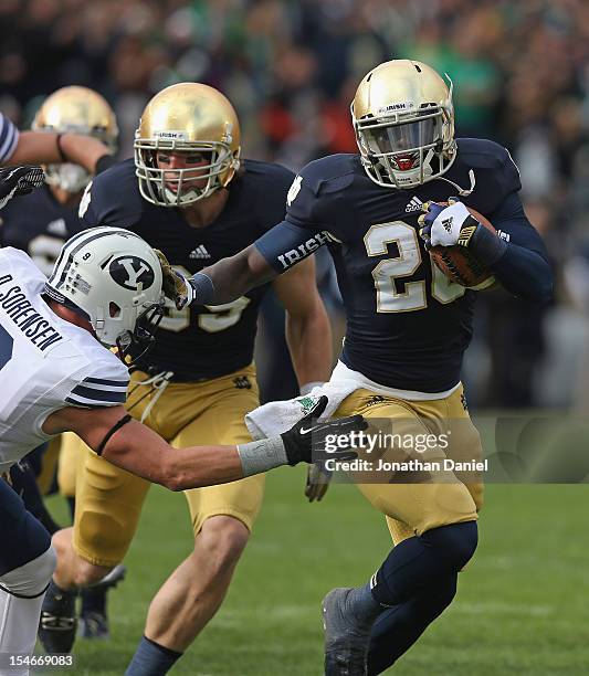 Cierre Wood of the Notre Dame Fighting Irish breaks away from Daniel Sorensen of the BYU Courgars at Notre Dame Stadium on October 20, 2012 in South...