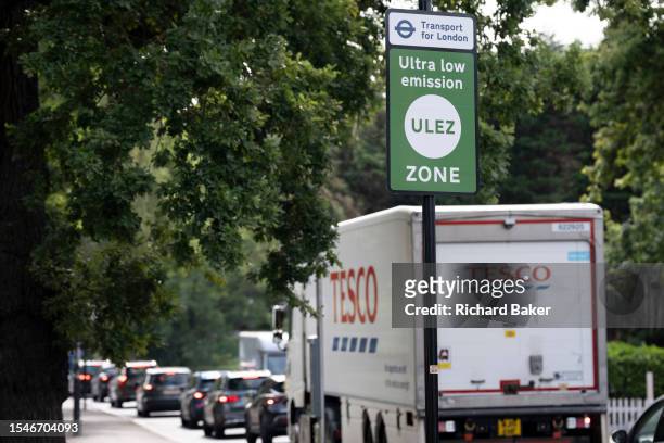 Queueing traffic passes an ULEZ sign on the South Circular at East Dulwich, on 21st July 2023, in London, England. Introduced by his Conservative...