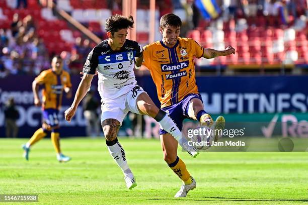 Joaquin Montecinos of Queretaro fights for the ball with Unai Bilbao of San Luis during the 3rd round match between Atletico San Luis and Queretaro...