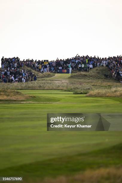 Fans watch as Viktor Hovland of Norway plays his shot from the 15th tee during the first round of The 151st Open Championship at Royal Liverpool Golf...