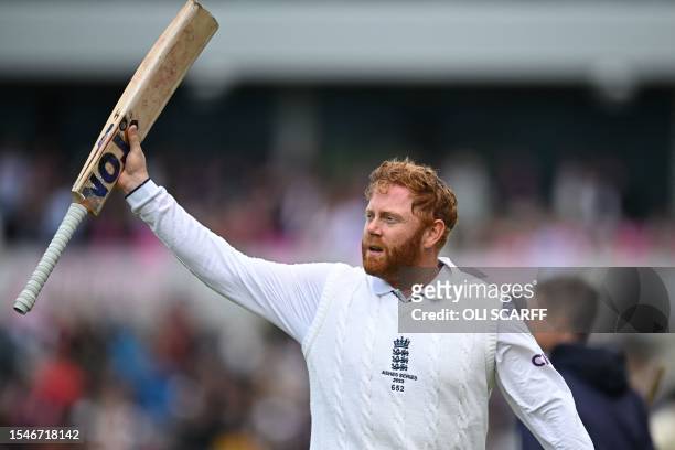 England's Jonny Bairstow raises his bat to the crowd as he leaves the field unbeaten on 99 on day three of the fourth Ashes cricket Test match...
