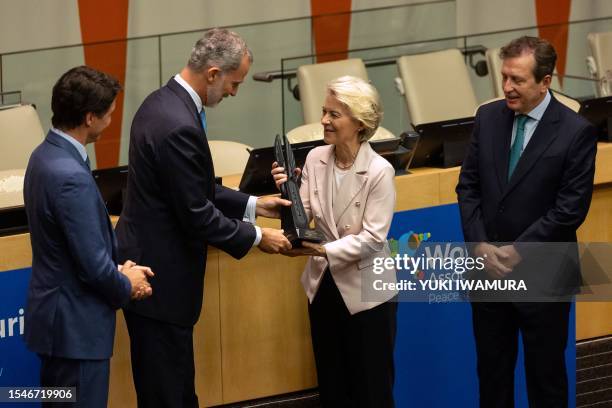 Spain's King Felipe VI, with Canadian Prime Minister Justin Trudeau and World Jurist Association President Javier Cremades, awards the World Peace &...