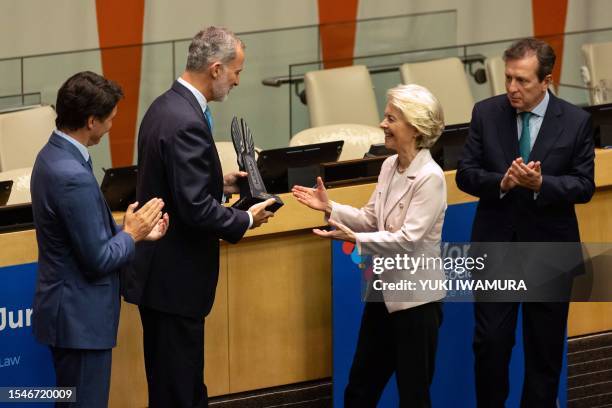 Spain's King Felipe VI, with Canadian Prime Minister Justin Trudeau and World Jurist Association President Javier Cremades, awards the World Peace &...