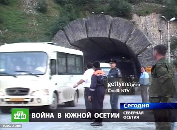 Russian NTV channel television grab shows buses carrying refugees driving from the South Ossetian conflict zone into North Ossetia in Verkhny Zaramag...