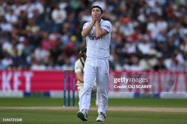 England's Mark Wood reacts after a ball nearly hits the stumps, having been left by Australia's Marnus Labuschagne on day three of the fourth Ashes...