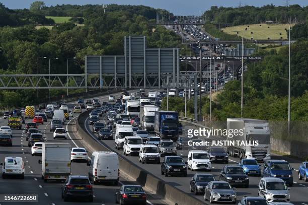 Friday rush-hour traffic jam is pictured on the M25 London orbital motorway, anti-clockwise lanes near Heathrow Airport, west of London on July 21,...