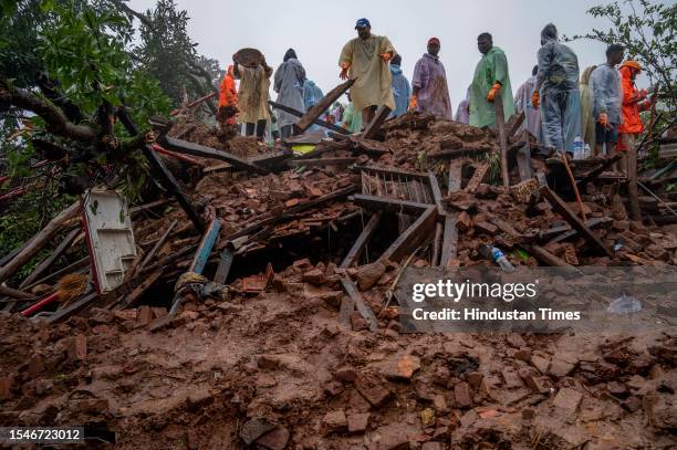 Rescue operations are going on the second day where people are trapped under rubble after a landslide in Khalapur Irshalwadi Village, on July 21,...