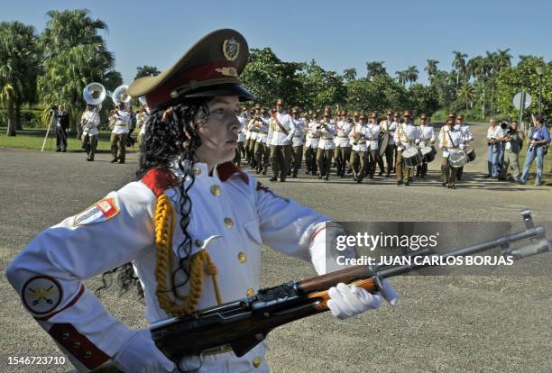 Female Cuban cadet prepares to take part in a wreath-laying ceremony at the Internacionalist Soviet Soldier Mausoleum, in the outskirts of Havana, by...