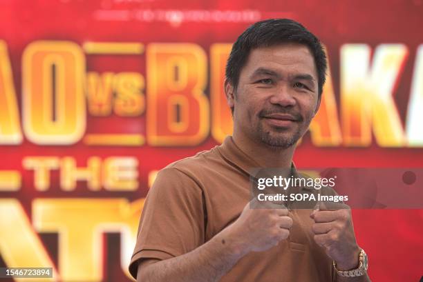 Manny Pacquiao, a Filipino boxer poses for a photo to the media during a press conference for the exhibition boxing fight at Iconsiam in Bangkok. The...
