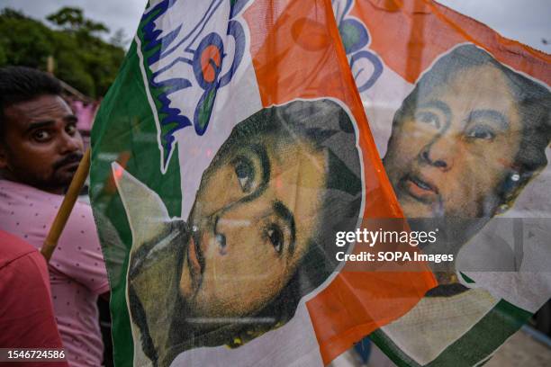 Trinamool Congress party supporters hold flags of West Bengal chief minister Mamata Banerjee while participating in the Annual Martyrs Day program at...