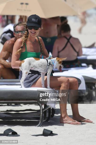 Nina Agdal is seen on the beach on July 21, 2023 in Miami Beach, Florida.