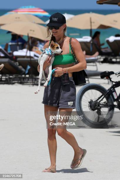 Nina Agdal is seen on the beach on July 21, 2023 in Miami Beach, Florida.