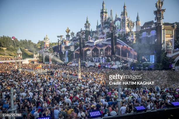 Visitors attend the first day of the Tomorrowland electronic music festival in Boom on July 21, 2023. / Belgium OUT