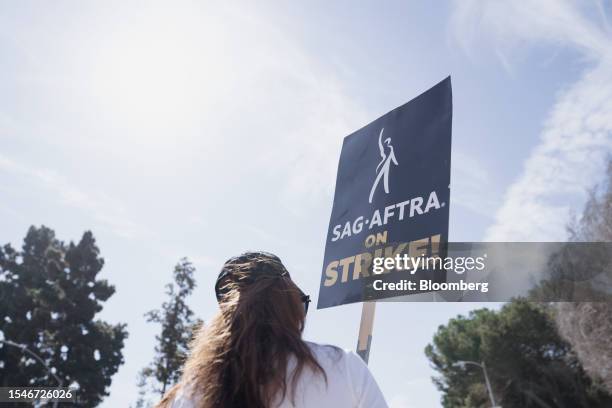 Sign is held supporting Screen Actors Guild members on a picket line outside Fox Studios in Los Angeles, California, US on Friday, July 21, 2023. As...