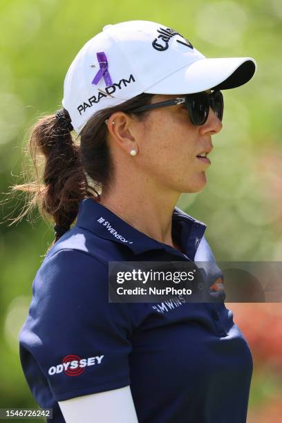 Emma Talley of the United States walks from the 17th tee with a ribbon pinned to her cap in honor of LPGA golfer Jane Park's daughter Grace Park...