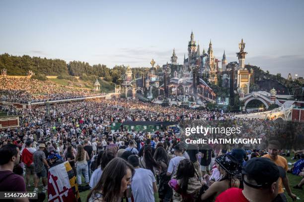 Visitors attend the first day of the Tomorrowland electronic music festival in Boom on July 21, 2023. / Belgium OUT