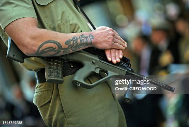 Member of the Australian Army stands to attention during a Vietnam Veterans Day service at the Cenotaph in Sydney on August 18, 2009. Veterans across...