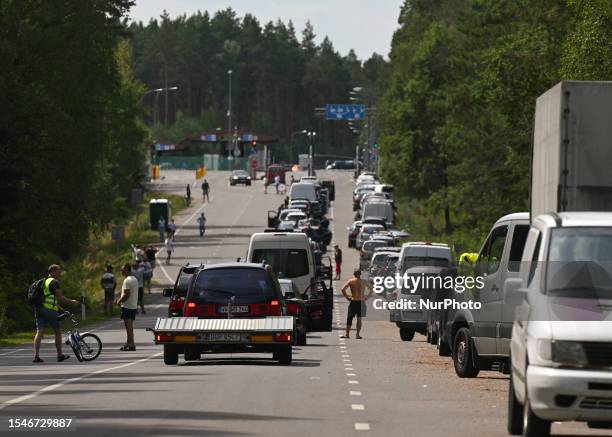 Line of cars left and parked near the border crossing station of Raigardas-Privalka, on July 15 in Druskininkai, Lithuania. Lithuanian border towns...