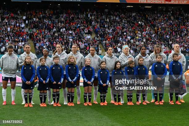 S team stands for the national anthem before the Australia and New Zealand 2023 Women's World Cup Group E football match between the United States...
