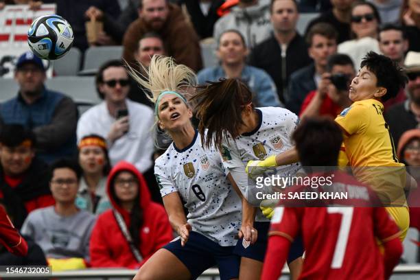 Vietnam's goalkeeper Thi Kim Thanh Tran attempts a save past USA's midfielder Julie Ertz and USA's forward Alex Morgan during the Australia and New...