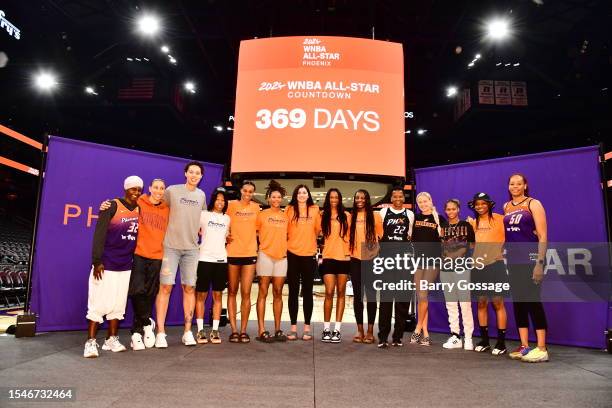 Bridget Pettis, Tangela Smith and Jennifer Gillom pose for a photo with members of the Phoenix Mercury after announcing they will host the 2024 WNBA...