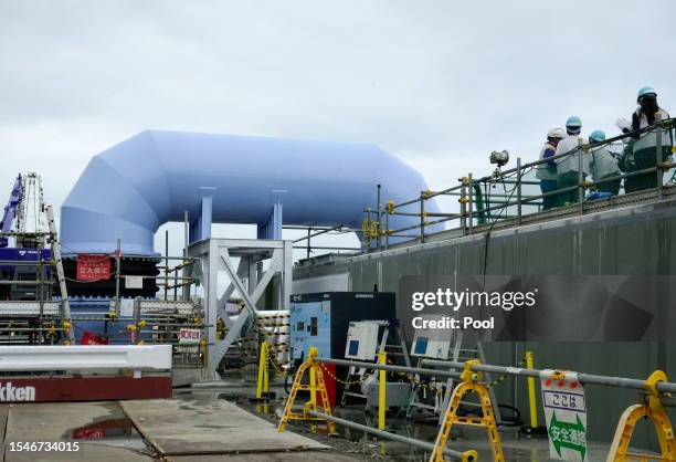 Foreign journalists inspect the facility for releasing the radioactive water treated by the Advanced Liquid Processing System into the sea at Tokyo...