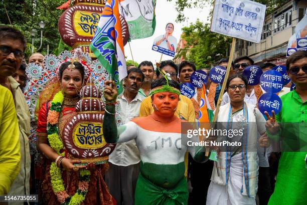 Supporters of the Trinamool Congress party are seen dressed in various attire during a rally addressed West Bengal's Chief Ministers and party...