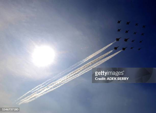 Sukhoi fighters and F16 Fighting Falcons of the Indonesian Airforce participate in the anniversary of the Indonesian Airforce in Jakarta on April 9,...