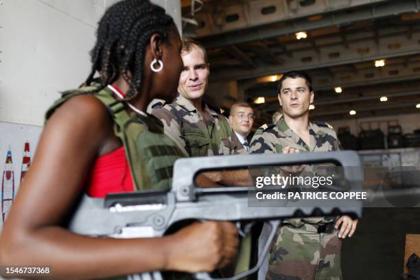 French Marine soldier gives explanations about a FAMAS assault rifles, on March 17, 2010 in Fort-de-France on the French island of La Martinique, in...