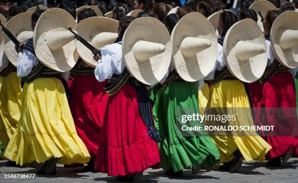 Female soldiers of the Mexican Army dressed as revolutionary "Adelitas", parade during the celebrations of the 200th anniversary of the country's...