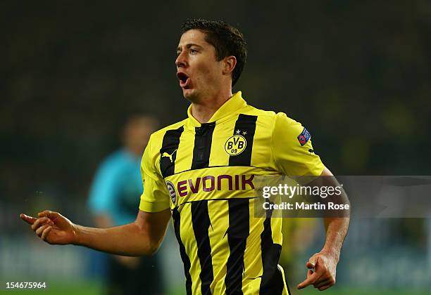 Robert Lewandowski of Dortmund celebrates after he scores his team's opening goal during the UEFA Champions League group D match between Borussia...